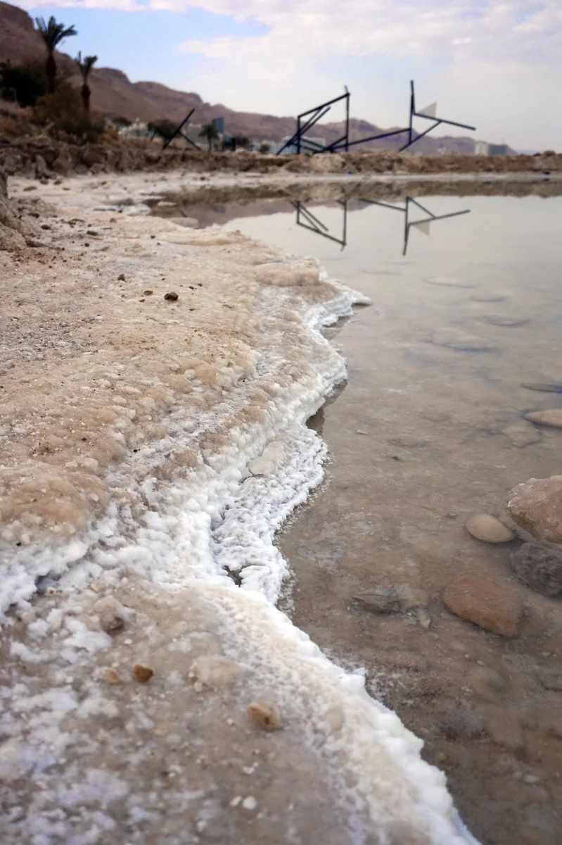 Salt crust on the Dead Sea shore, the last stop of a Masada and Dead Sea day trip from Jerusalem